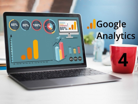 Laptop displaying Google Analytics 4 dashboard with data visualizations and performance metrics, alongside a red coffee mug.